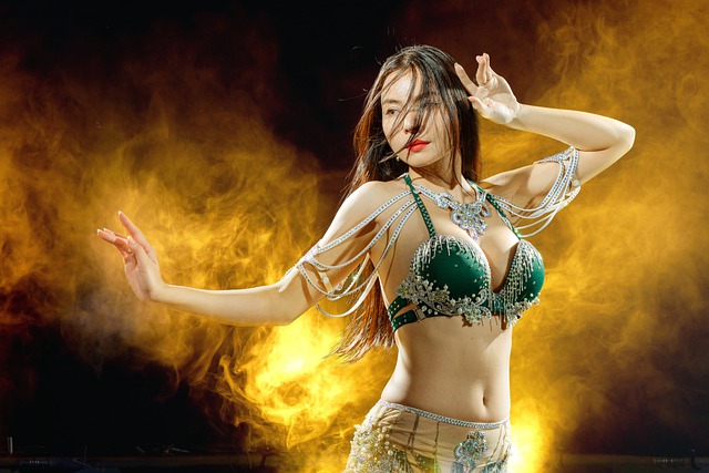 An Image That Depicts A Graceful Dancer, Adorned In Vibrant, Flowing Garments, Mesmerizingly Moving Her Hips And Torso With Precision, Exuding Confidence, While Showcasing The Rich Cultural Heritage Of Belly Dance