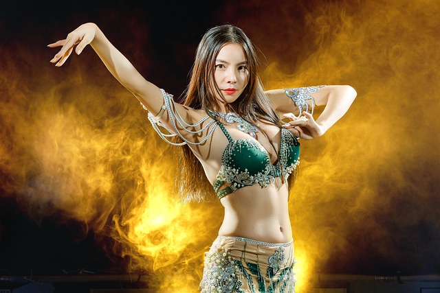 Rizing Image Capturing The Essence Of Belly Dance Improvisation: A Graceful Dancer, Adorned In Vibrant Silk Veils, Moving Effortlessly To The Rhythm Of Enchanting Middle Eastern Music, Embodying The Flow Of The Melodies With Fluidity And Passion