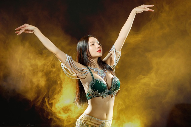 An Image Capturing The Essence Of Belly Dance Practice And Progression: A Determined Dancer, Gracefully Executing A Challenging Movement With Fluidity, While Mirroring Their Reflection In A Studio Mirror