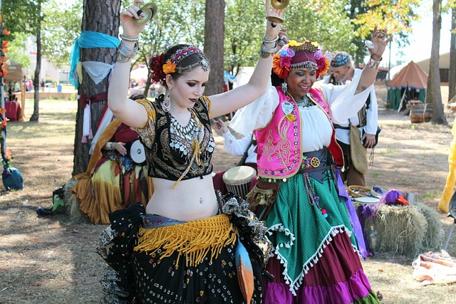 An Image Of A Serene Desert Oasis At Sunset, Where A Belly Dancer Gracefully Moves, Enveloped By Vibrant Silk Veils