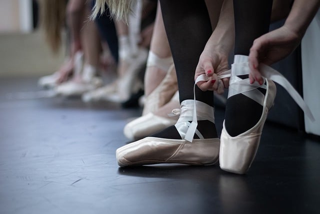 An Image Featuring A Graceful Ballet Dancer In A Spotlight, Capturing The Captivating Presence And Individuality Of A Soloist