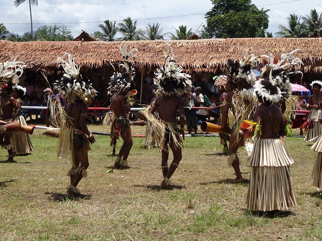 The Essence Of Tribal Belly Dancing In An Image: A Group Of Fierce And Vibrant Women, Adorned In Colorful And Intricate Costumes, Gracefully Moving Their Hips And Hands In Synchrony, Surrounded By A Mystical Desert Landscape